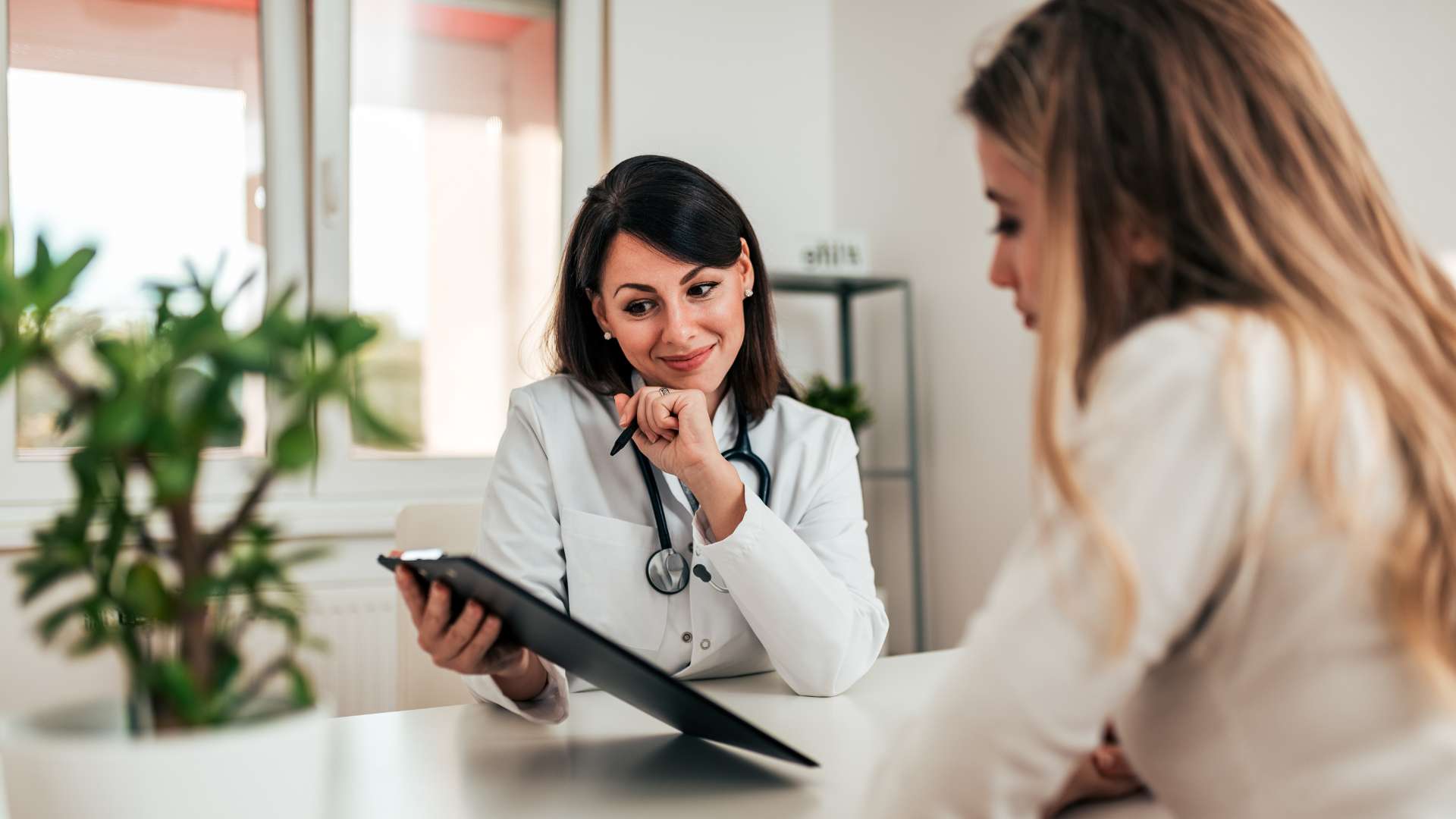 Drug Addiction More Common Doctor and Patient Look at Chart at VATP Oregon