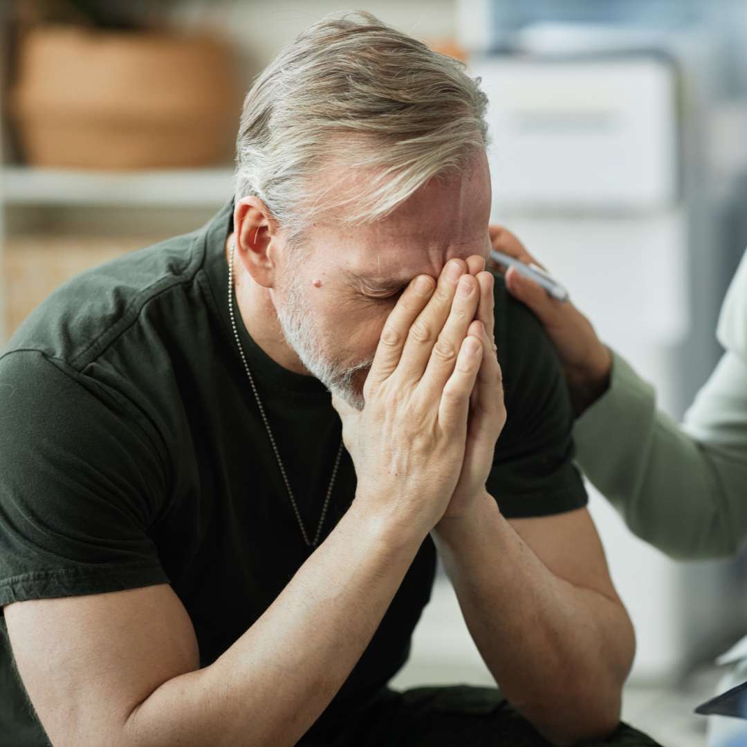 PTSD Symptoms in Veterans Addiction Therapist Comforting Vet at Virtue At The Pointe Oregon During Group Therapy